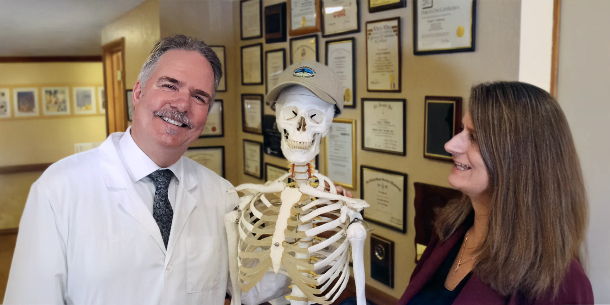 Chiropractor Sacramento CA Gregg C. Anderson, D.C. and Dina Anderson with Skeleton Model